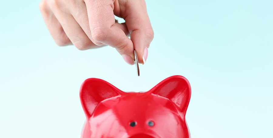 coins into red piggybank